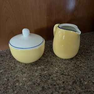 Vintage yellow, blue and white stripe creamer and sugar bowl.
